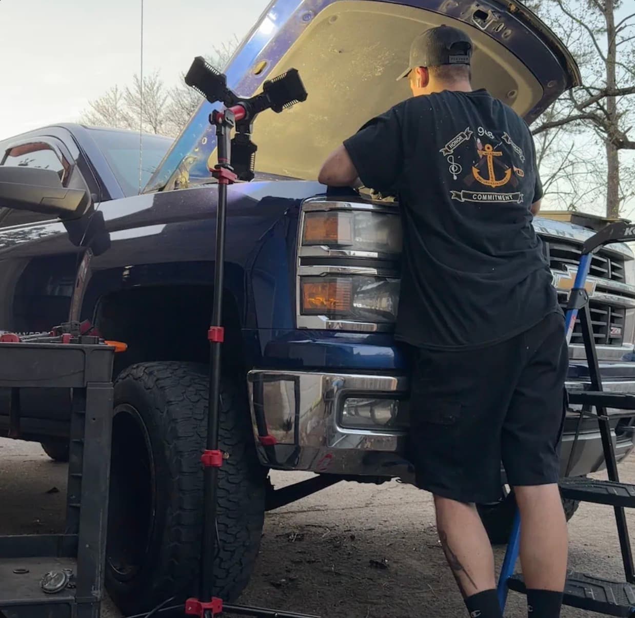 Marcus Winfree working on a vehicle